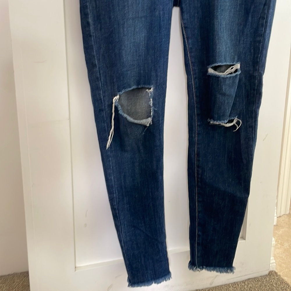 Super soft skin jeans with holes in both legs.